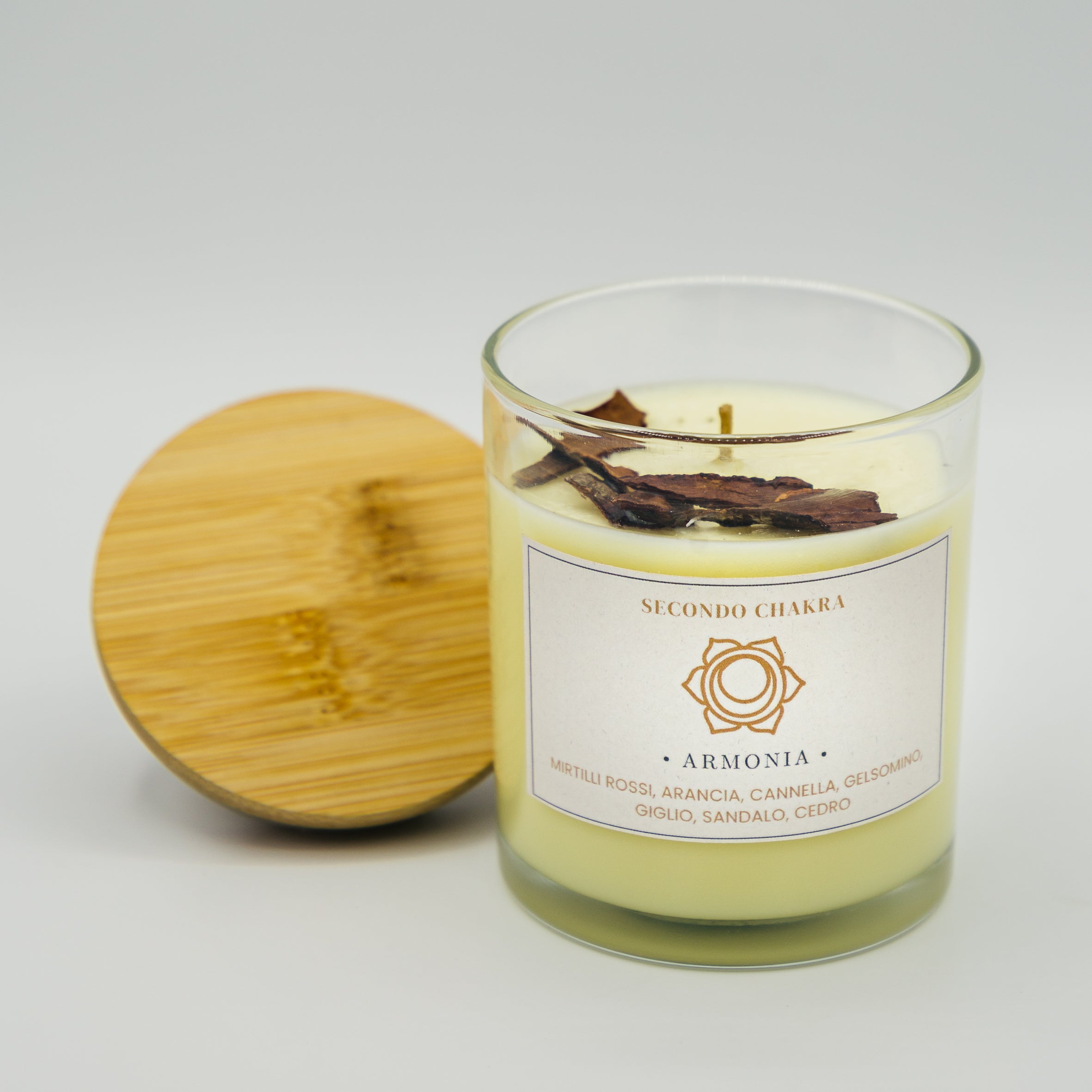 Candela Armonia Secondo Chakra con note di arancia, gelsomino e legni pregiati in vaso di vetro
