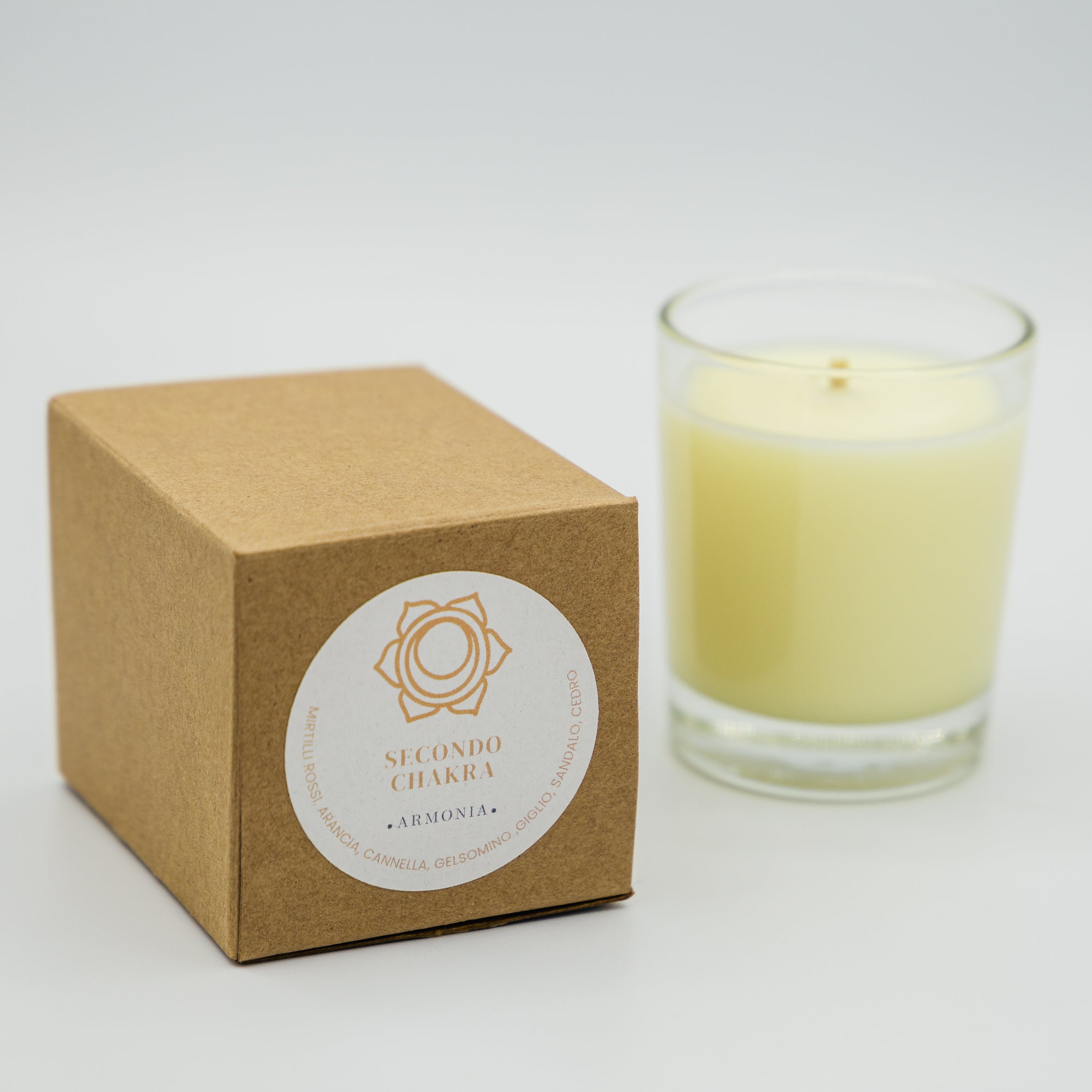 Candela armonia secondo chakra in vetro con confezione in cartone per il benessere energetico