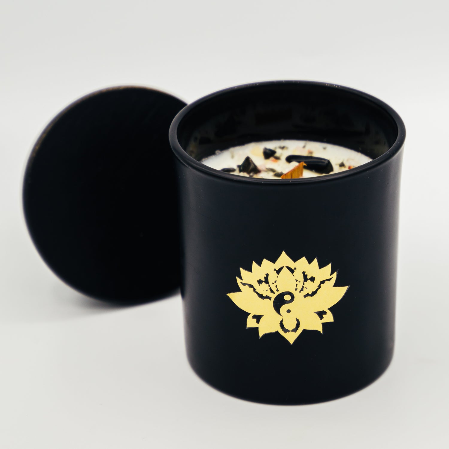 Candela con cristalli in contenitore nero con design di loto per aromaterapia e meditazione