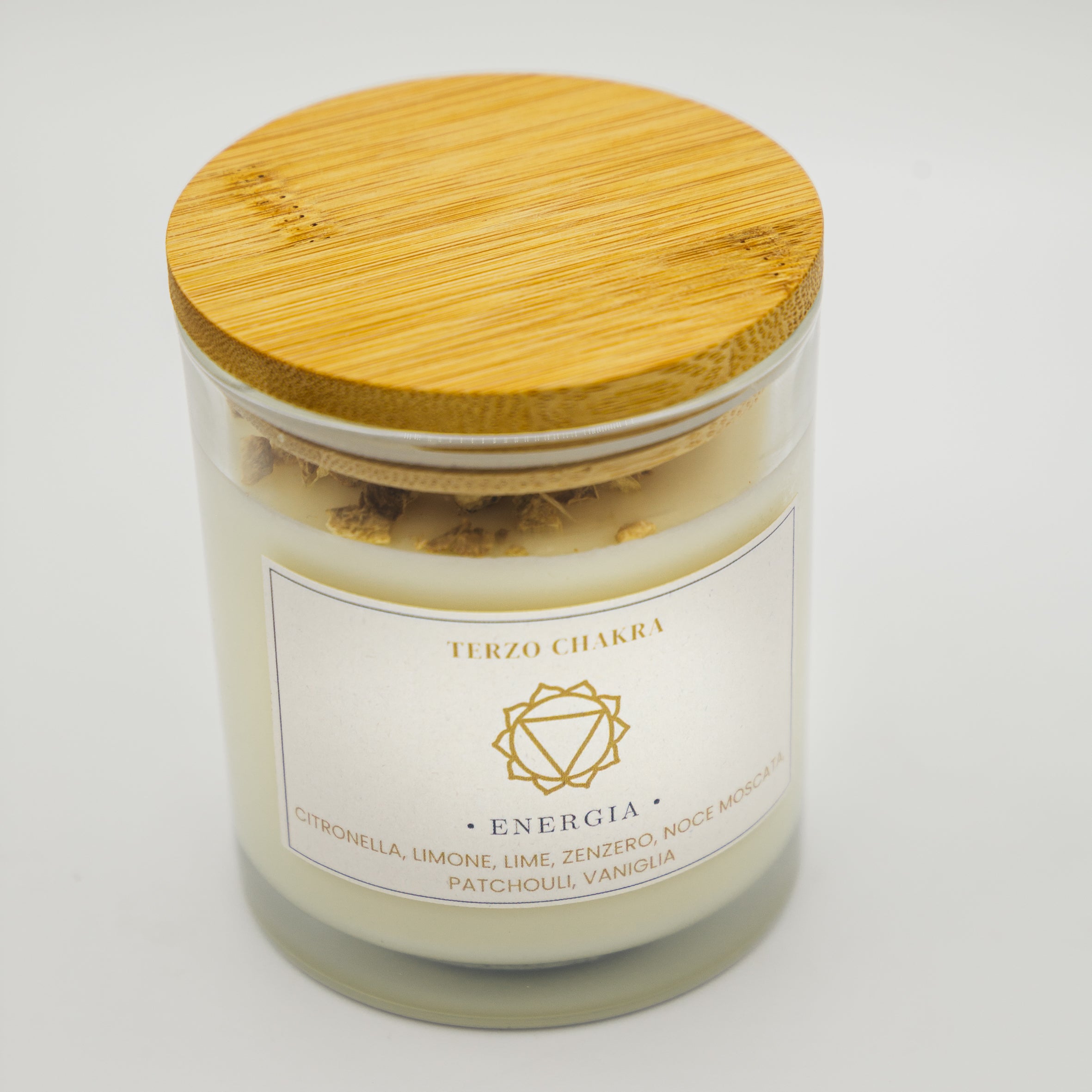 Candela energia terzo chakra in vetro con aromi di citronella e vaniglia per la meditazione
