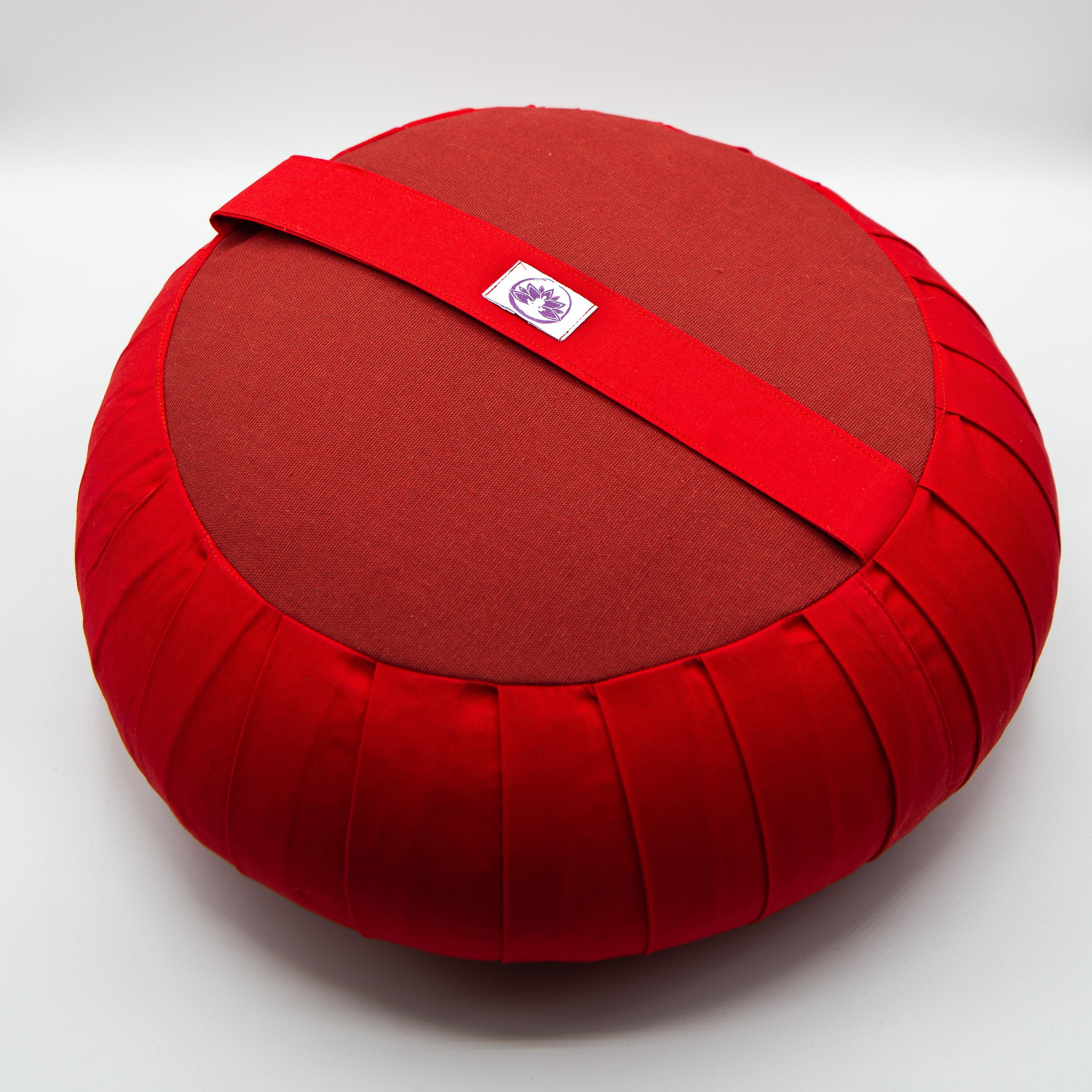 Cuscino Zafu Classico rosso con una comoda maniglia per il trasporto e design ergonomico