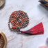 Collana mala diaspro rosso e ossidiana con nappo rosso, perfetta per meditazione e benessere