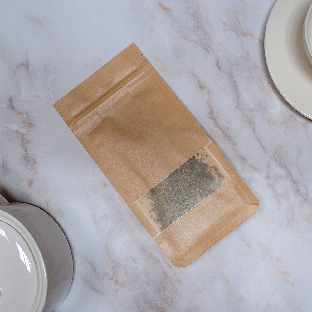 Pacchetto di tisana quarto chakra in carta marrone, perfetto per la meditazione e il benessere