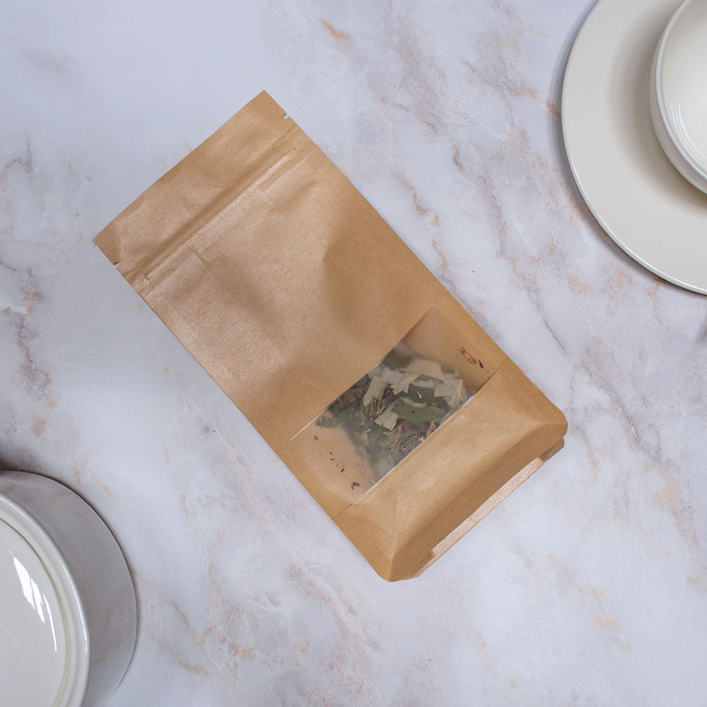 Confezione di tisana quinto chakra con finestrella trasparente per visualizzare la miscela di erbe