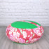 Cuscino zafu meditazione con design floreale rosa e verde per un comodo supporto durante la meditazione